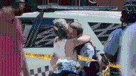 Security guard embraces mother after shooting armed robbery suspect