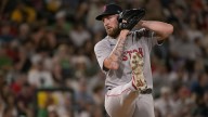 Red Sox’s Trevor Story gives Garrett Crochet his flowers after defeating Athletics