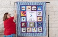 ‘Put faces to the statistics’: Survivors of Suicide Support Group displays quilt honoring family members who’ve died