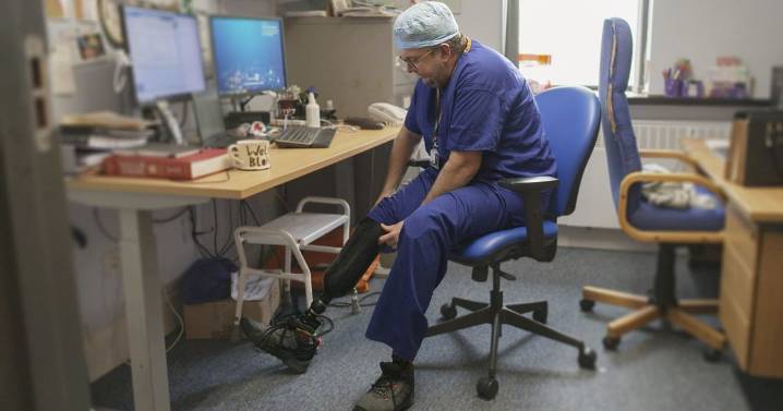 NHS surgeon given £466k after awful lie about having his own legs amputated jailed