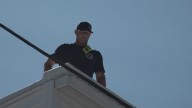 Firefighters climb rooftop to raise money for muscular dystrophy