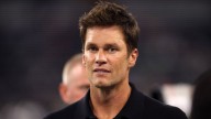 Tom Brady shown in Raiders' booth wearing headset during MNF