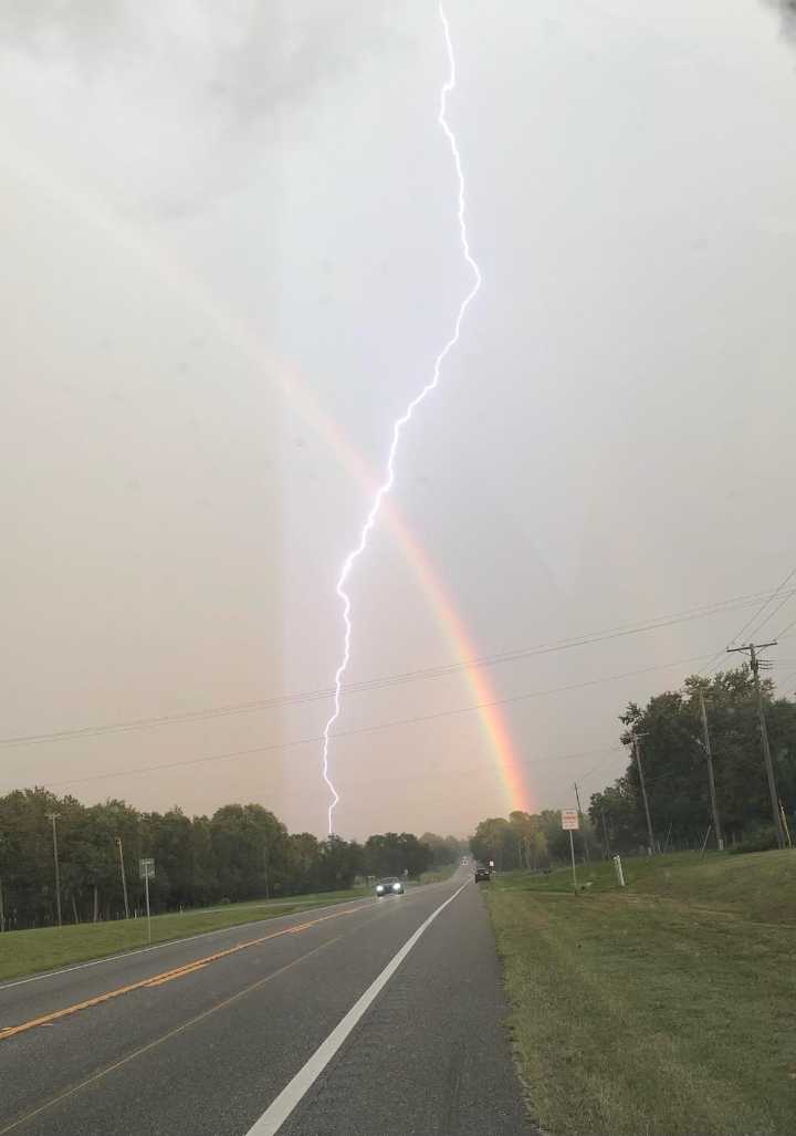 Central Florida man captures rare lightning strike through rainbow