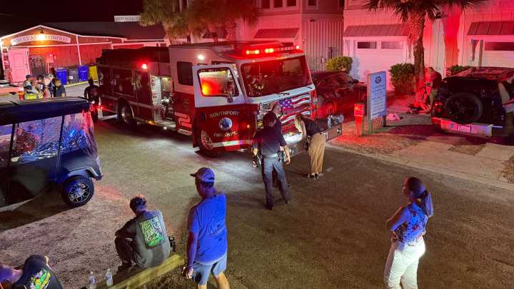 Law enforcement officials respond to a shooting in…