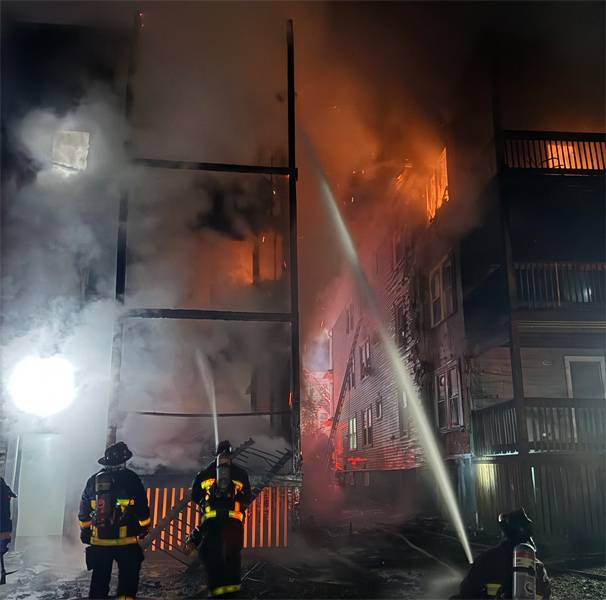 Firefighter, resident injured as fire on Centre Street in Dorchester spreads from one three decker to another