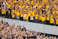 College football traditions: 'Hawkeye Wave' bonds everyone in stadium with kids in adjacent hospital