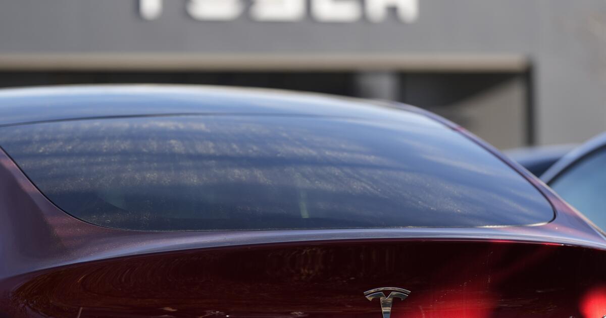 Tesla under investigation after parents say faulty door handles trapped their kids in the back