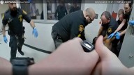 Ohio county agrees to $7M settlement over man's death after jail guards restrained him, family says