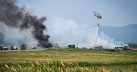Crews work to extinguish ignited hay bales in grass fire west of Kalispell