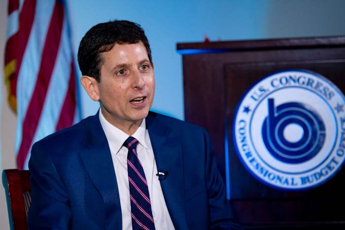 He's the budget scorekeeper for Congress. Lately, it's been a tough job