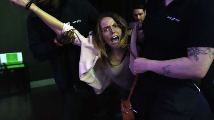 Moment protesters are dragged from Reform UK conference as Farage accuses them of 'being on the sauce'