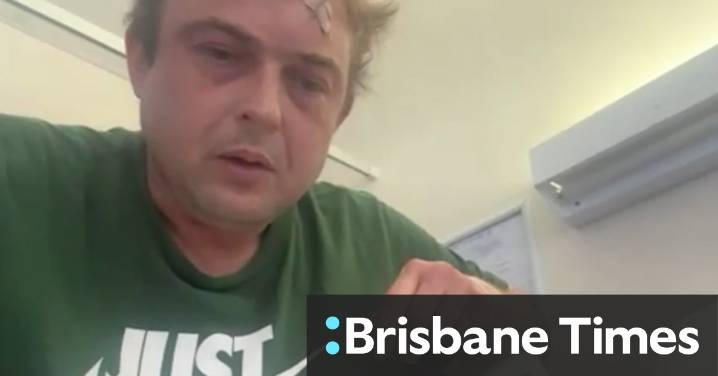 A man has been charged after allegedly attacking his neighbours with an axe