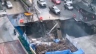 Watch: Massive sinkhole opens near Bangkok hospital, swallows cars, power poles