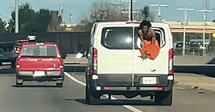 Video shows inmate hanging from rear window of Oklahoma prisoner transport van