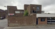 Offensive graffiti covering area of Midlands town as it appears on pub, takeaway and bridges