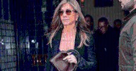 Jennifer Aniston Ditches All-Black for Color in Purple Dress for NYC Outing