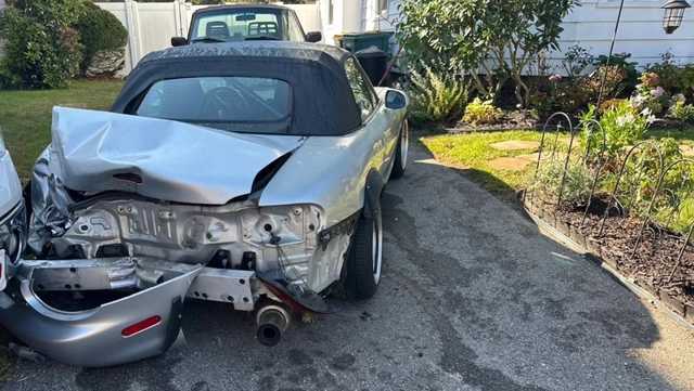 Driver strikes several parked cars, slams into Abington home