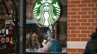 Starbucks to close hundreds of stores, lay off 900 workers as part of turnaround plan