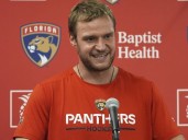 Florida’s Aleksander Barkov helped off ice after leg injury
