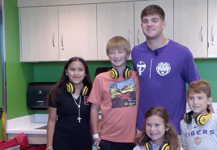 LSU quarterback Garrett Nussmeier brings smiles to children at Our Lady of the Lake