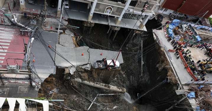 Massive sinkhole swallows part of a Bangkok road, forcing evacuations in Thailand's capital