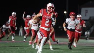 Portsmouth's Jackson Hackley hauls in a 23-yard touchdown vs. Westerly
