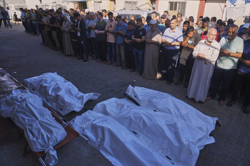 Strikes across Gaza kill at least 31 as international scholars accuse Israel of genocide