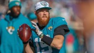 Lions sign quarterback to practice squad, release pass rusher
