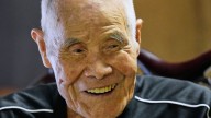 Japanese man becomes oldest to summit Mount Fuji at 102 with help from his family