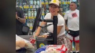 Singer Chiquis Rivera buys groceries for customers at a Vallarta Supermarket in Van Nuys