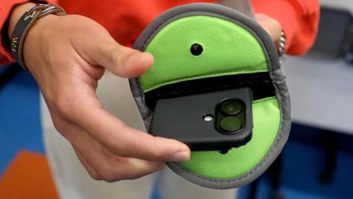Schools across U.S. turn to a locked magnetic pouch as a cellphone ban solution. Here's what to know.
