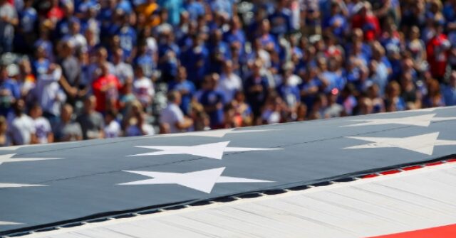 VIDEO: Man Gets Stuck on Giant American Flag at Jets