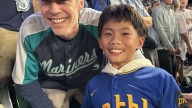 Random act of kindness: Mariners fan gifts historic ball to young stranger