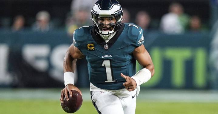 Eagles edge Cowboys in wild, lightning-delayed season opener