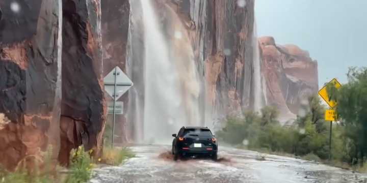 VIDEO: Travelers in Utah fearlessly drive through waterfalls caused by flash flooding