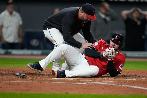 Guardians' David Fry carted off field after being hit in face by pitch while trying to bunt
