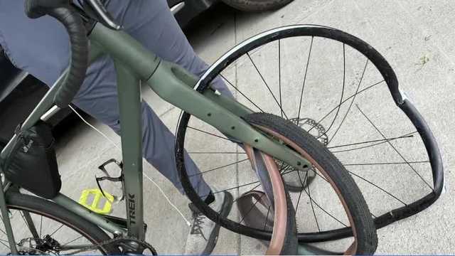 Cyclist survives crash after split
