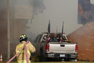 Police remain on scene at burned out Michigan church after shooting and fire leave 4 dead, 8 wounded
