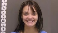 Woman smiles widely after ‘slashing her sleeping boyfriend with hatchet’
