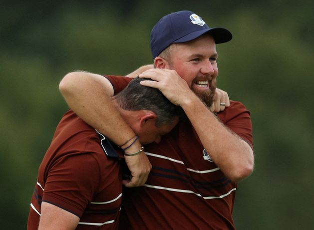 Shane Lowry and Rory McIlroy overcome torrent of abuse to leave Europe on brink of famous Ryder Cup win
