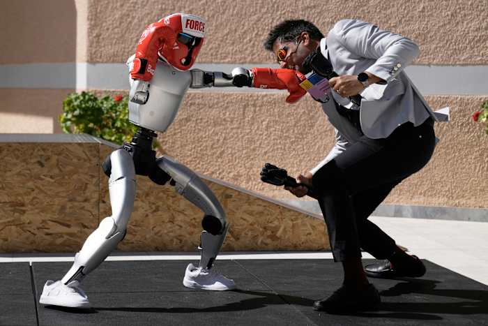 Humanoid robots showcase skills at Ancient Olympia. But they're on a long road to catch up to AI