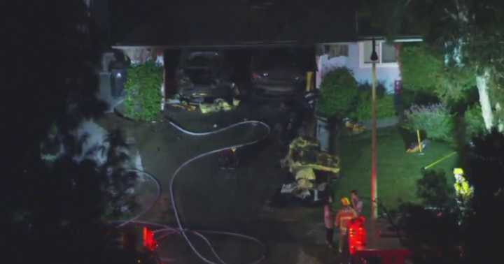 Firefighters in West Hills near Calabasas extinguish house fire