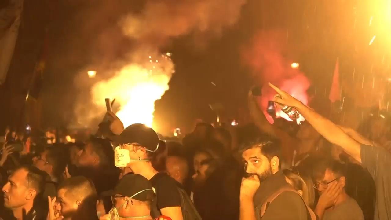 Tear gas is fired in Serbia at thousands of protesters demanding free elections and justice