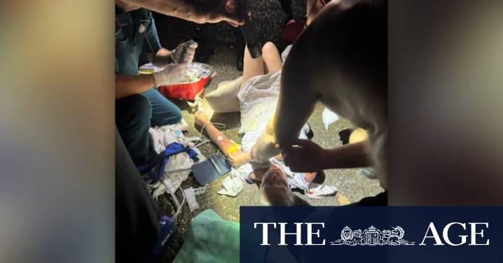 Man charged over alleged axe attack on neighbours