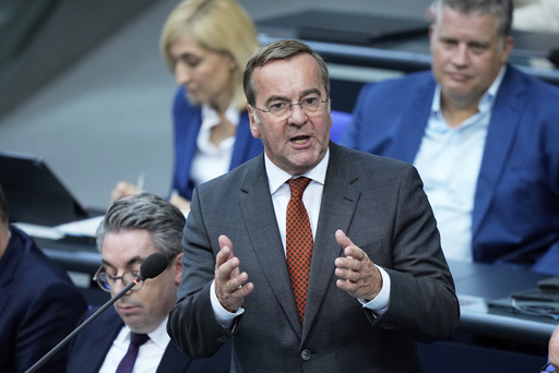 German defense minister says Russia is tracking two satellites used by the German military