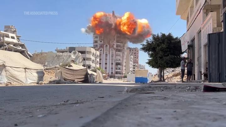 Israel’s military destroys multiple buildings in Gaza City, after warning residents to leave