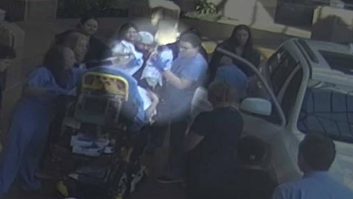 Oh baby! Surprise delivery just outside Dallas hospital caught on camera