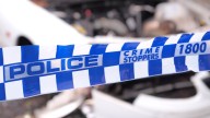 Woman charged as police seize enough explosives to potentially destroy building, alongside seven firearms