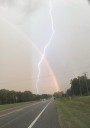 Central Florida man captures rare lightning strike through rainbow