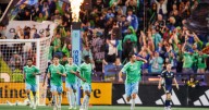 Sounders and Whitecaps play to 2-2 tie; Seattle clinches playoff spot and Vancouver move into 1st